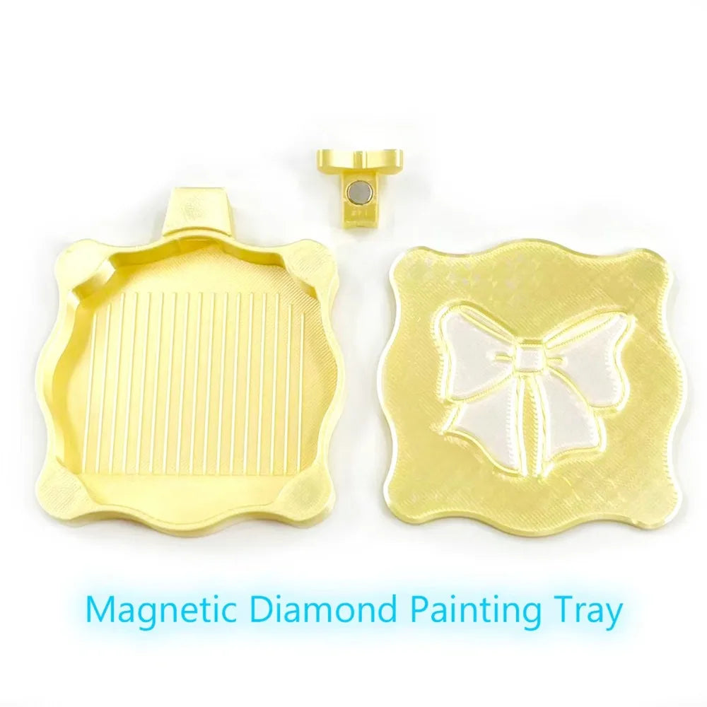 A yellow magnetic diamond painting tray with a lid and a decorative bow knot design.