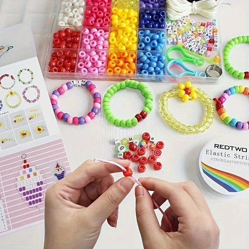 A DIY bracelet making kit showing various colored letter and pony beads in small plastic containers and a hand stringing a br
