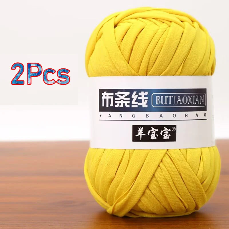 A ball of yellow soft chunky t-shirt yarn for crochet and knitting, packaged as a 2-pack.