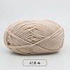 A ball of light beige pre-dyed milk cotton yarn used for knitting and crochet.