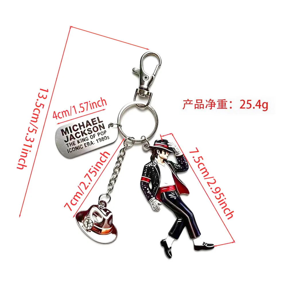 A keychain featuring a figure of Michael Jackson in a dance pose.