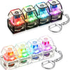 A set of illuminated stress-relief keychain toys featuring colorful keyboard buttons and clear plastic housing.