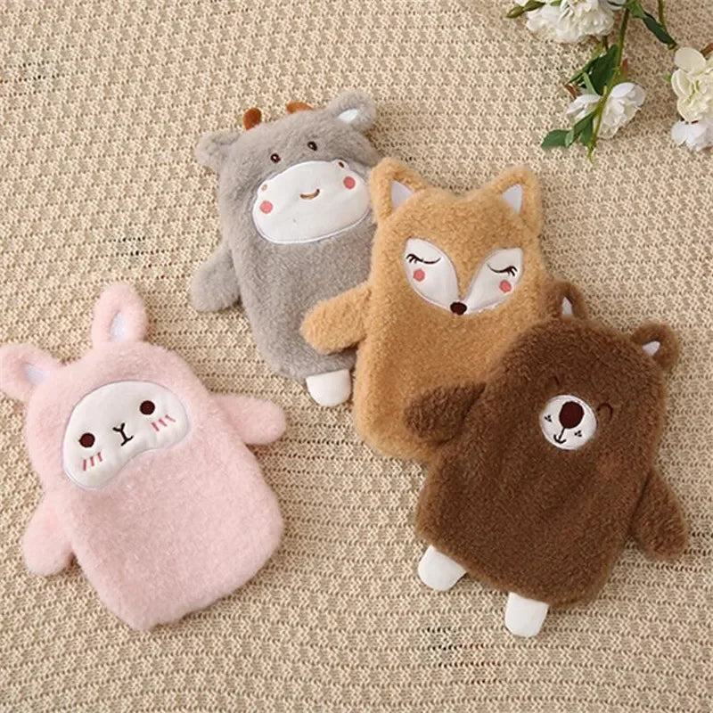 Three plush animal toys, including a gray sheep, an orange fox, and a brown bear, lying on a beige fabric.