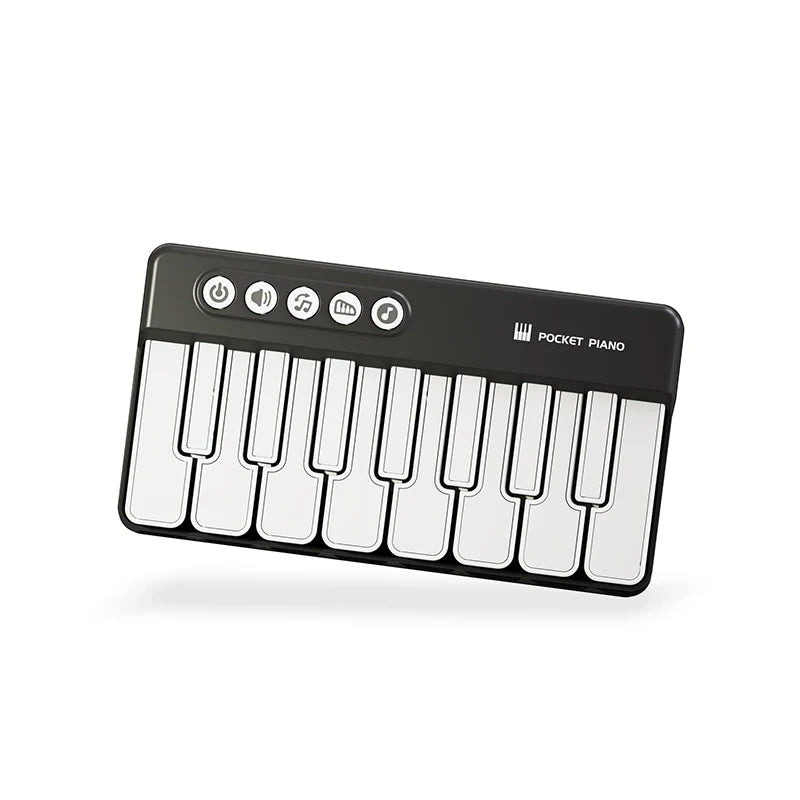 A black mini piano with white keys and LED indicators is shown.
