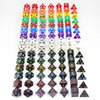 A vertical arrangement of colorful acrylic dice in various shapes and colors for tabletop role-playing games
