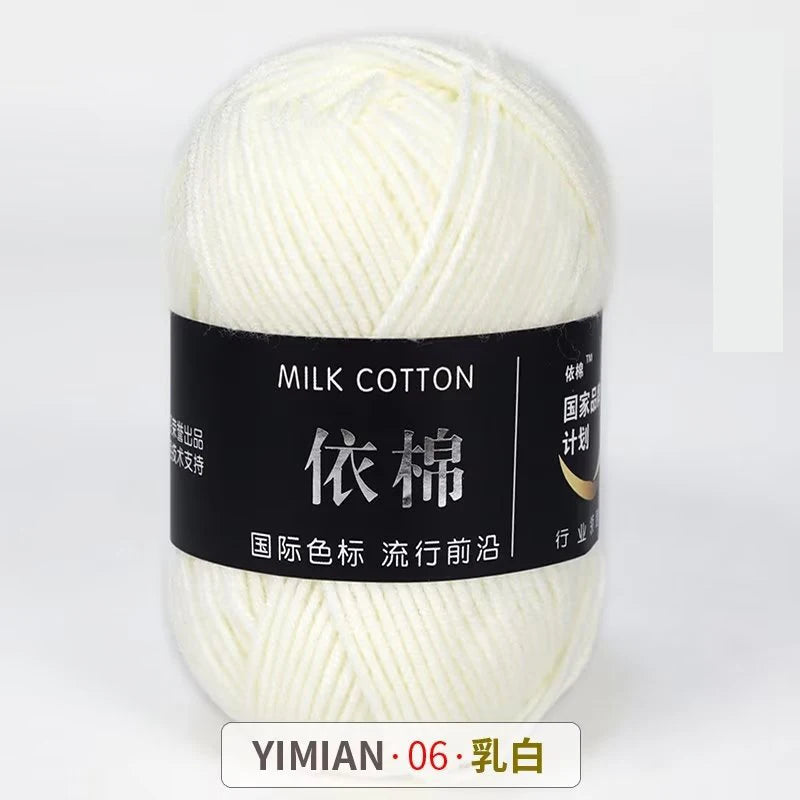 Ball of white milk cotton yarn for knitting and crochet labeled YIMIAN 06