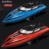 A side view of a red and blue high-speed RC boat model with a sleek design.