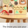 A wooden busy board for Montessori activities featuring various shapes and musical elements like a guitar and airplane.