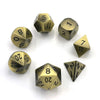 A set of premium metal polyhedral dice with a multicolor gold finish arranged in a circle.
