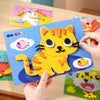 A hand holds a yellow cat 3D sticker puzzle piece featuring orange stripes and large eyes against a blue background.