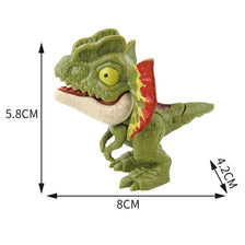 A green finger dinosaur fidget toy with movable joints and a red-tipped mouth, shown from the side.