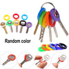 A set of random colored key sleeves and a large keyring with various keys.