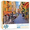 A 1000-piece jigsaw puzzle of Van Gogh's Starry Night depicting a colorful street scene in an old European city.