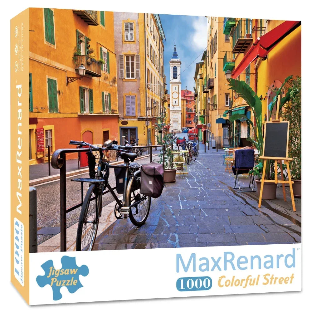 A 1000-piece jigsaw puzzle of Van Gogh's Starry Night depicting a colorful street scene in an old European city.