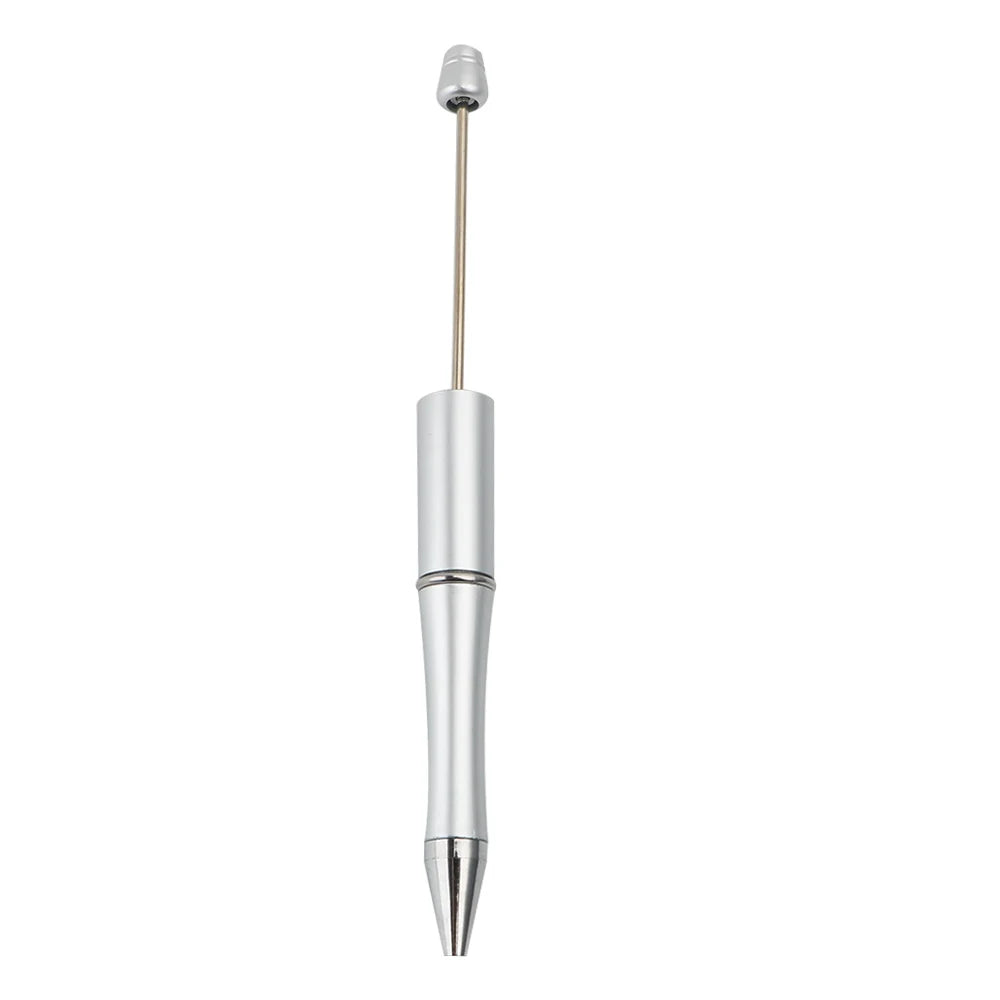 Silver ballpoint pen with a gold-colored tip and silver barrel.