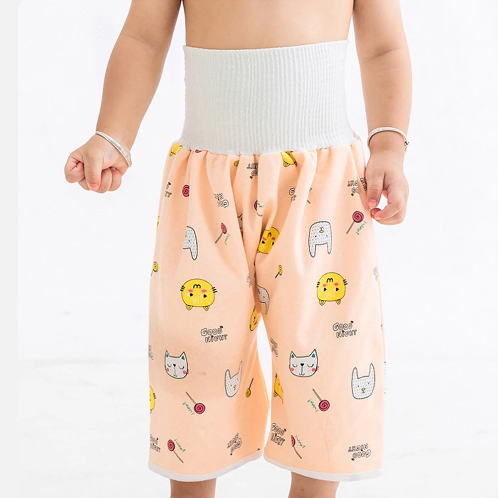 A baby wearing waterproof diaper pants with a skirt for potty training.