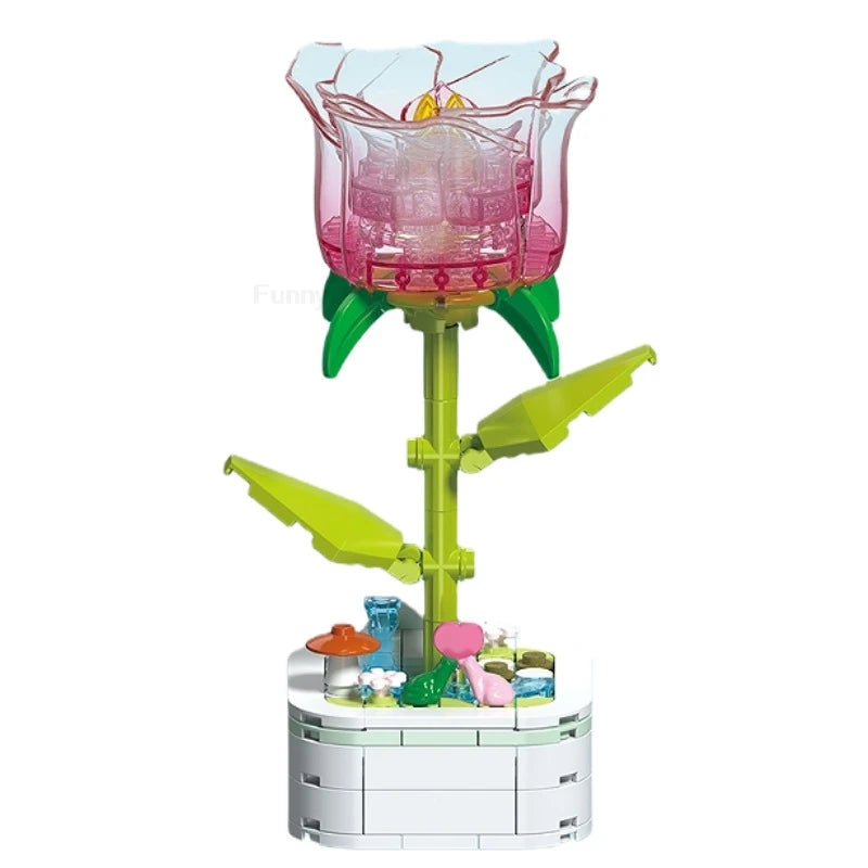 A building block set shaped like a pink rose flower with green leaves and a white base.