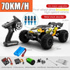 A black brushless 4WD monster truck RC car is shown with various upgrades and accessories.