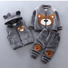 A gray fleece hooded sweater set for kids featuring a cartoon bear design on the front.
