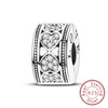 A silver heart charm bead for bracelets featuring intricate patterns and a love motif.