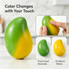 A green mango squishy stress ball changing color from emerald green to warm yellow.