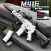 A white M416 electric continuous transmission rifle is displayed on a gray surface with accessories.