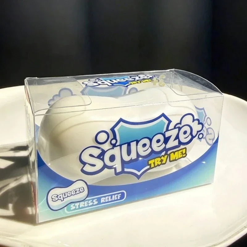 A clear plastic package of a white squishy stress ball labeled Squeezzer Try Me Stress Relief