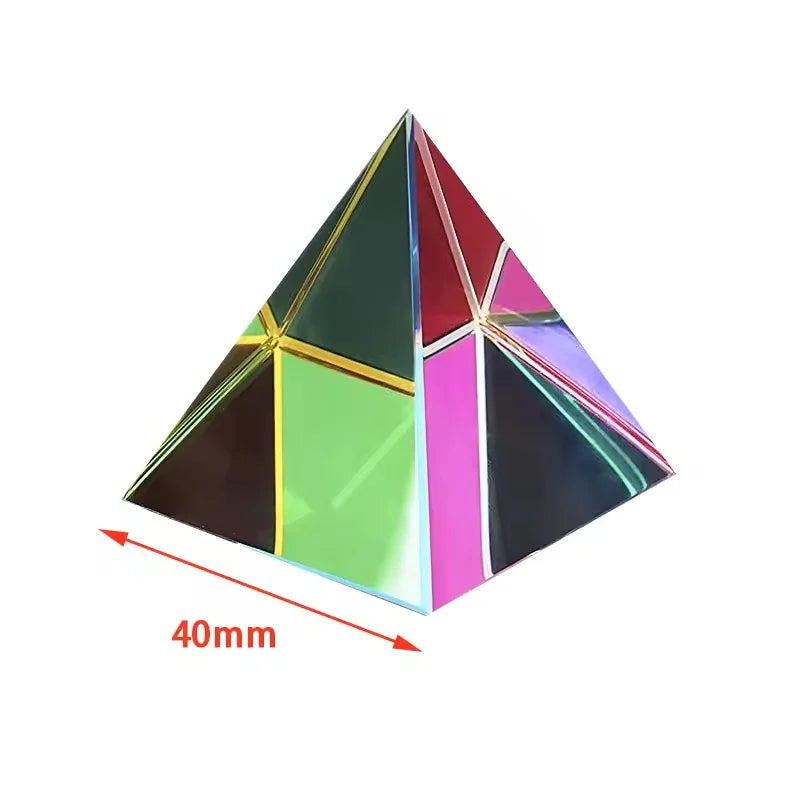 A geometric prism cube made of colored glass or acrylic, displaying various vibrant colors like green, pink, and red.