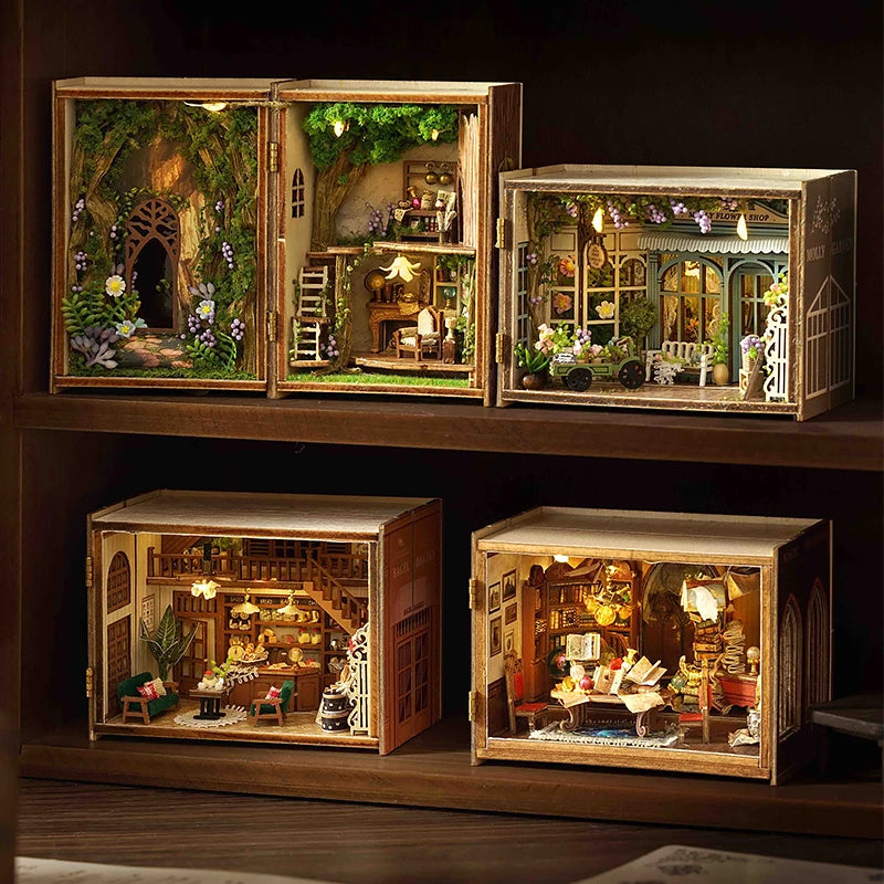 A wooden miniature dollhouse kit featuring detailed furniture, plants, and lighting elements displayed in an open box.