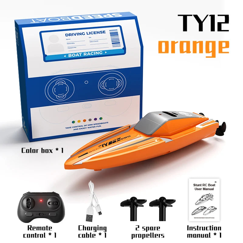Orange TY12 speedboat kit including a box, remote control, charging cable, and two propellers.