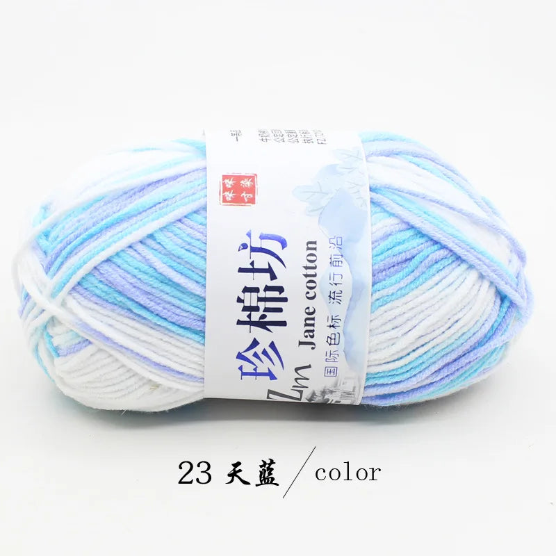 A ball of light blue and white yarn labeled as Jim Jane cotton yarn for knitting and crochet