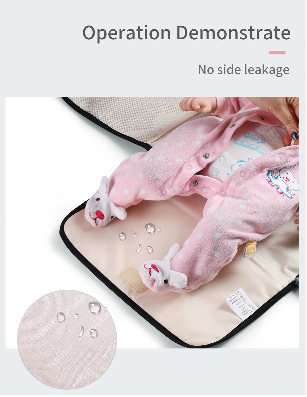 A pink baby changing mat is shown with a baby wearing a matching pink outfit, demonstrating no side leakage.