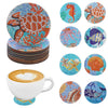 A set of DIY diamond art coasters featuring various animal designs like a tiger, fish, and seashell.