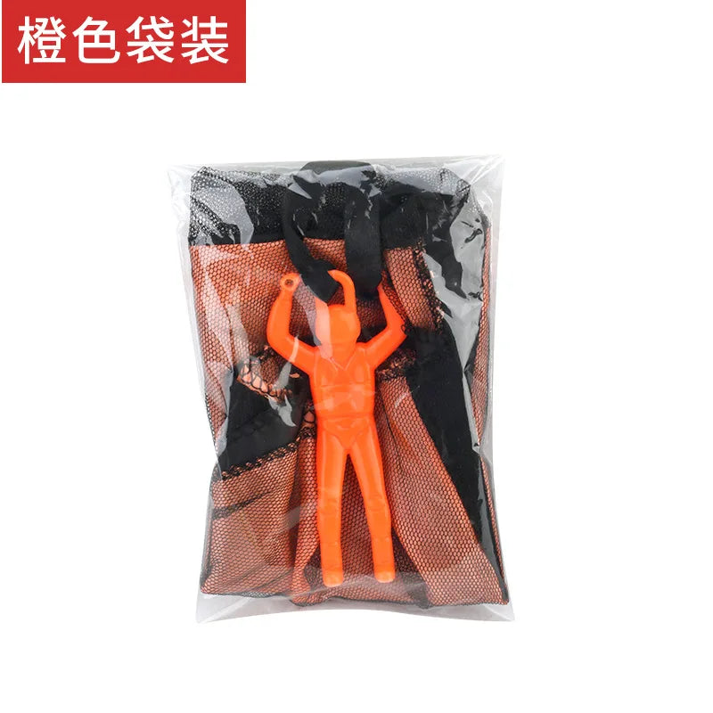 Orange Handwerf-Parachutespielzeug für Kinder in einer klaren Plastiktüte