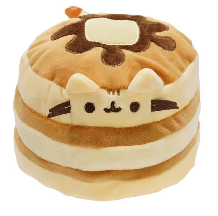 A soft, tan and cream plush cat toy with brown accents, designed as a desk or room décor item.