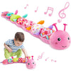A colorful plush caterpillar toy with musical notes and a rattle, being played with by a baby.