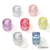 A collection of colorful acrylic alphabet beads in various shades including blue, pink, purple, and green.