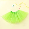 A bright lime green tulle tutu dress for girls with sparkly accents and a yellow ribbon.