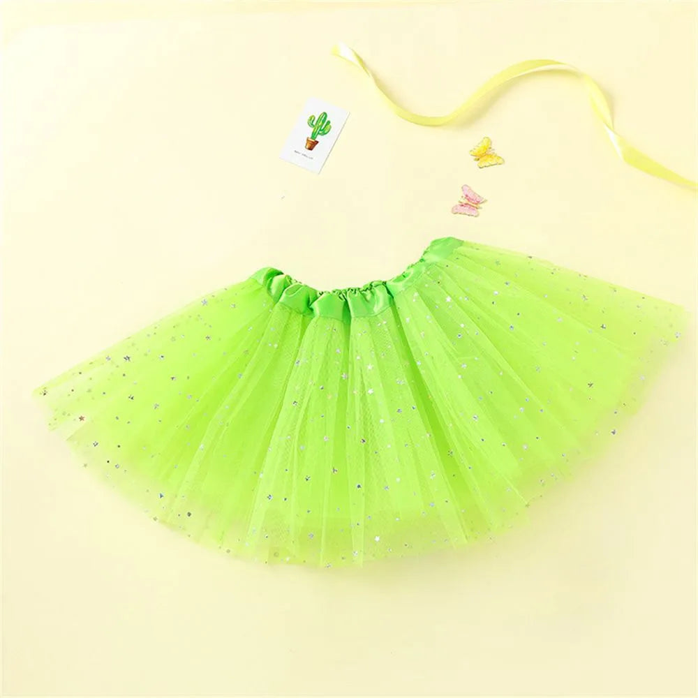 A bright lime green tulle tutu dress for girls with sparkly accents and a yellow ribbon.