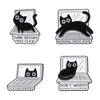 Set of four black cat enamel pins featuring humorous phrases related to working from home and programming.
