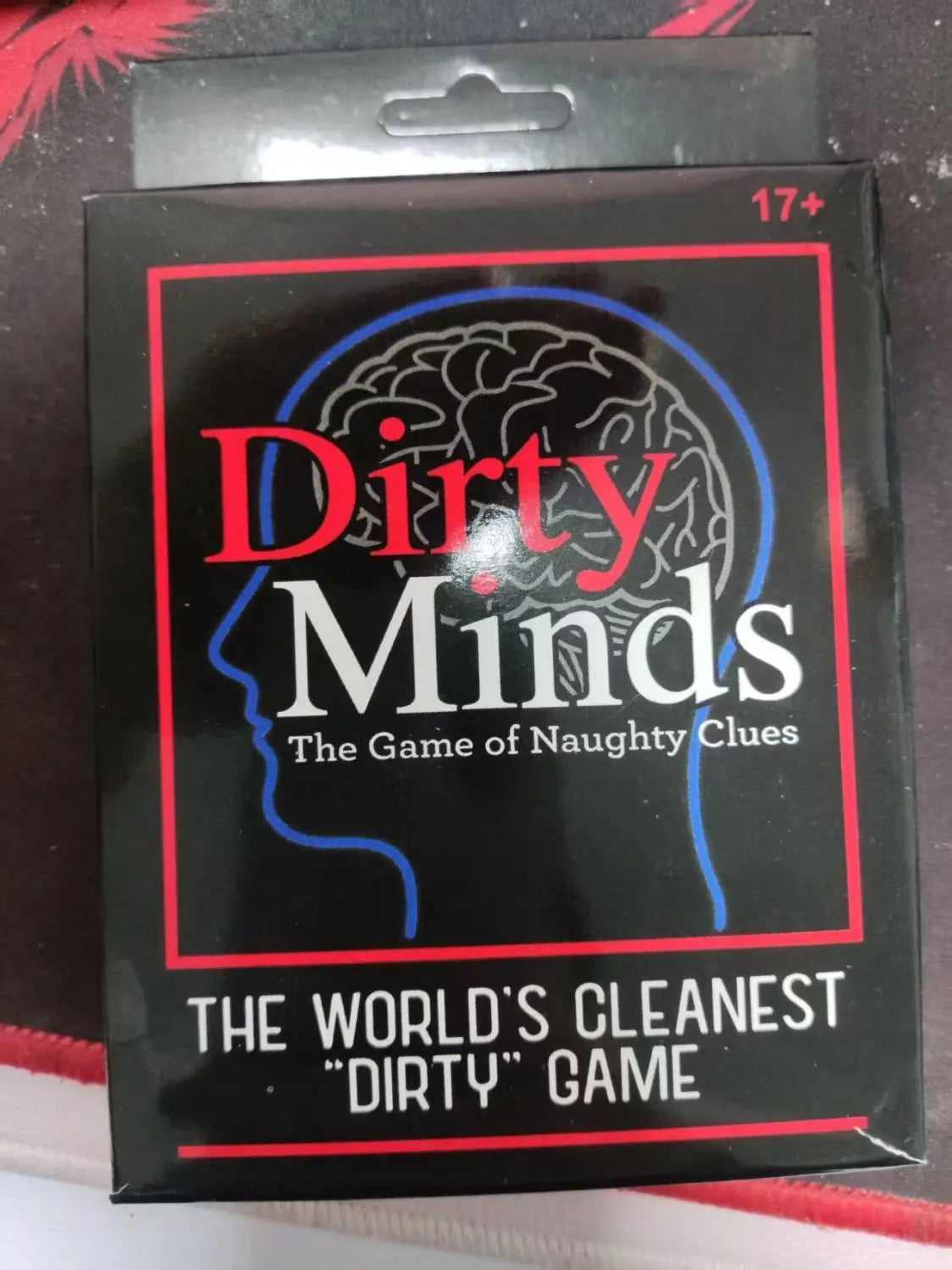 Box of the Dirty Minds party card game featuring a silhouette of a brain and text describing it as the cleanest dirty game