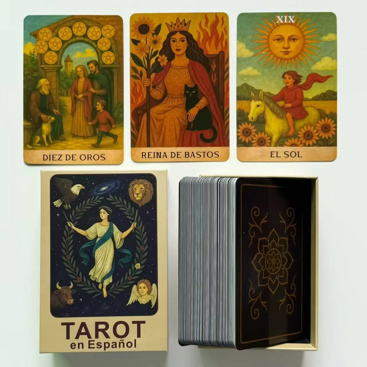 A collection of Spanish Tarot cards including Diez de Oro, Reina de Bastos, and El Sol, displayed next to a box of Tarot card
