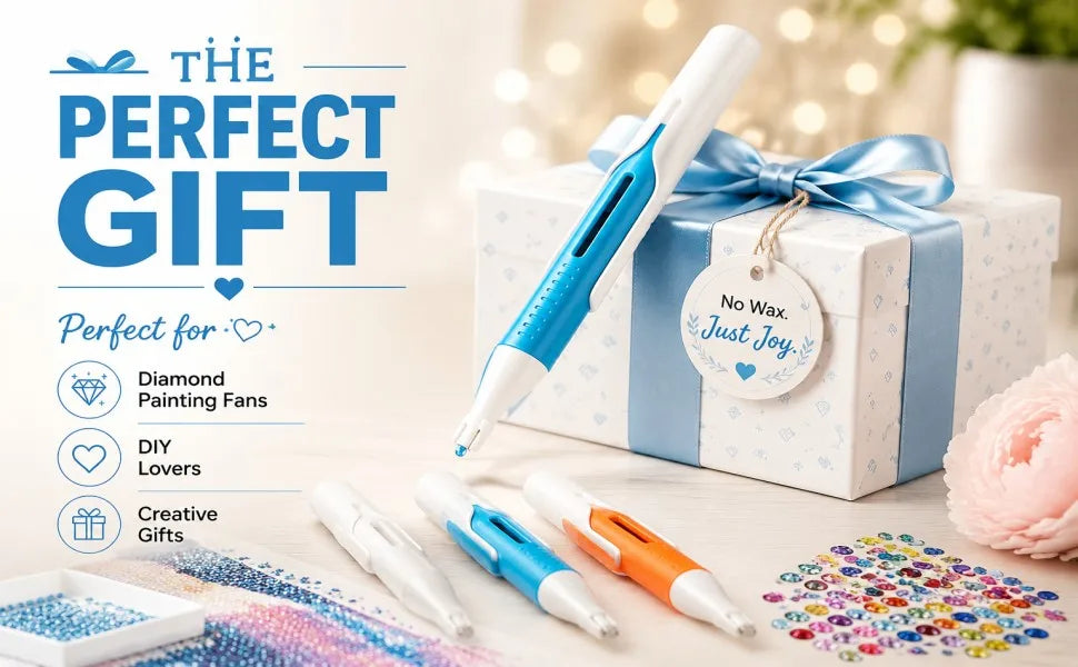 A white diamond painting pen is shown next to a gift box and several other pens on a surface.