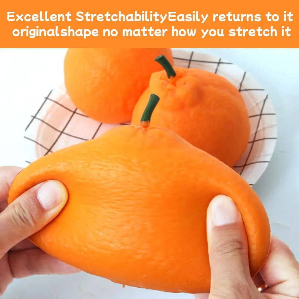 A hand is squeezing a realistic orange stress ball, demonstrating its stretchability.