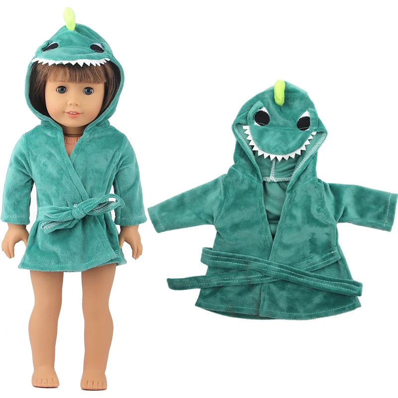 A green cartoon dinosaur bathrobe and nightgown set for a doll