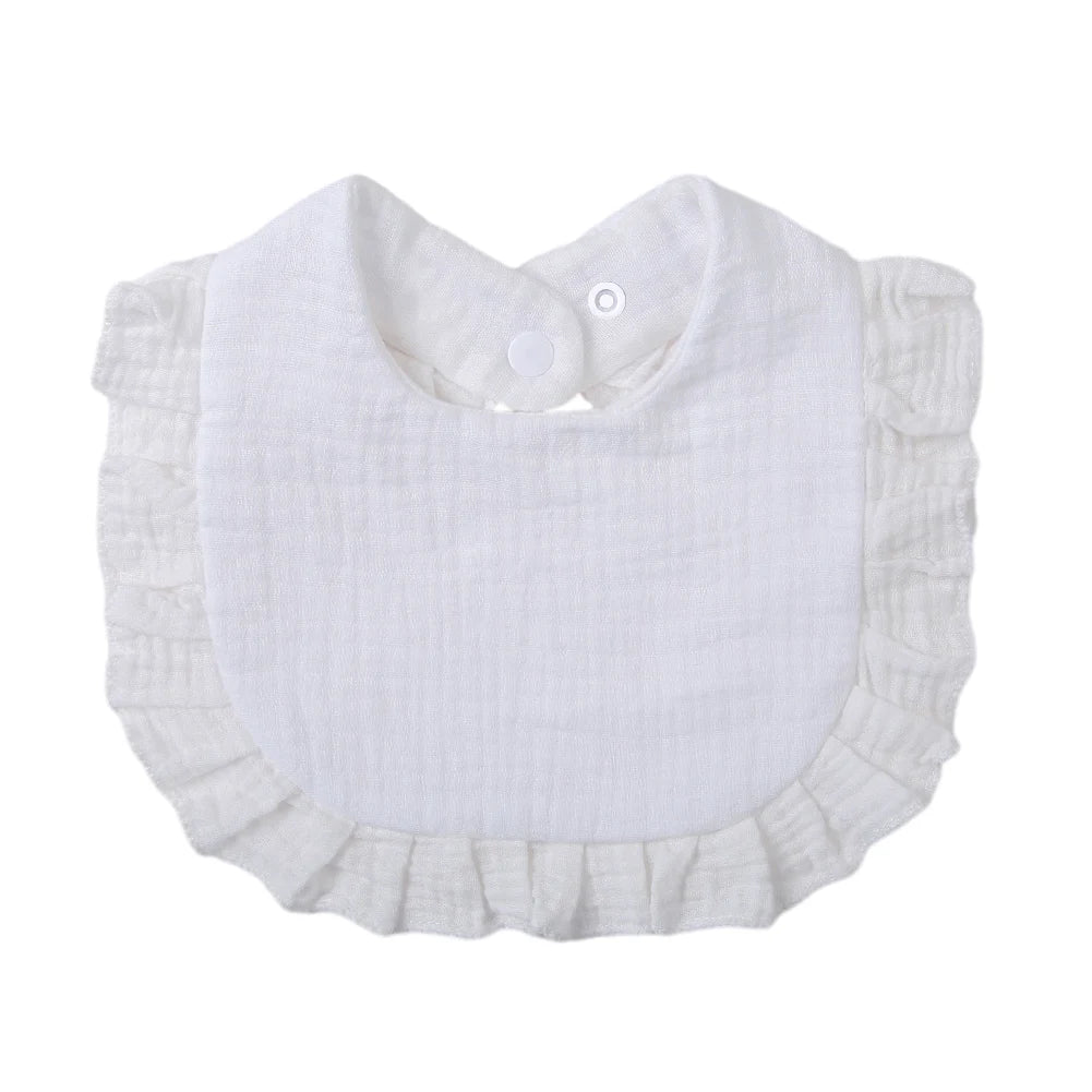 White ruffled muslin cotton baby bib with an adjustable snap closure