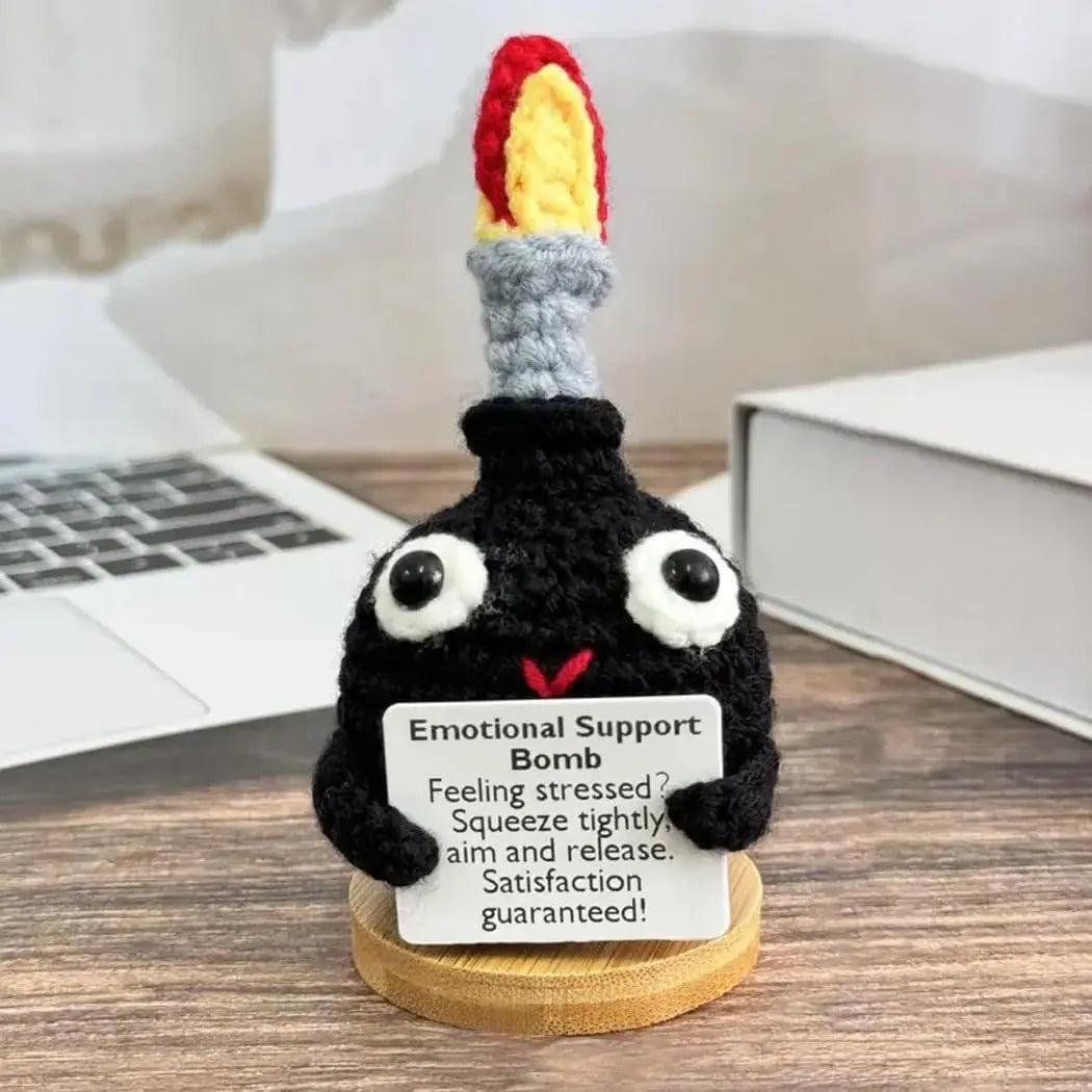 Handmade crochet bomb doll with an encouragement card featuring a colorful, textured top