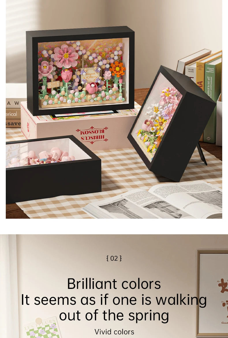 A display board featuring pink and orange flowers built from 3D flower building blocks.