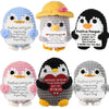 Handmade crochet penguin dolls with positive messages on cards in various colors