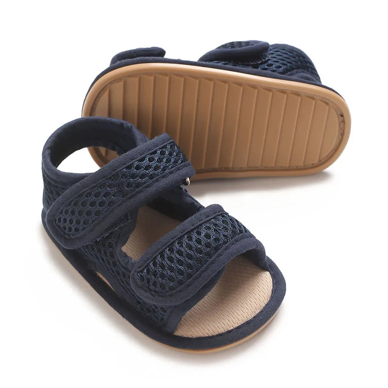 Navy breathable first walker sandals for baby with a soft sole and hook-and-loop closure